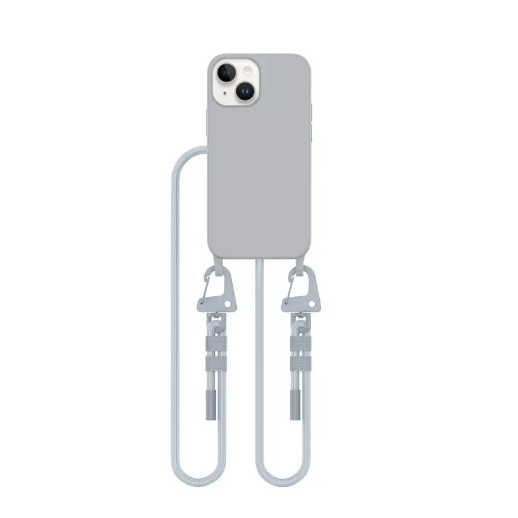 Szare etui z białym sznurkiem crossbody. Wbudowany pierścień magnetyczny MagSafe idealny do mocowania akcesoriów. Wygodny sznurek pozwala na noszenie telefonu iPhone 13 Mini, chroniąc go przed upadkami.